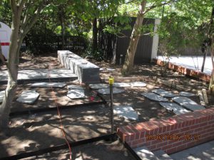 Ian Barker Gardens have designed a beautiful garden containing bluestone random paving and stacked bluestone walls