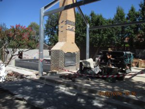 Steel framework goes up in Camberwell garden designed by Ian Barker Gardens